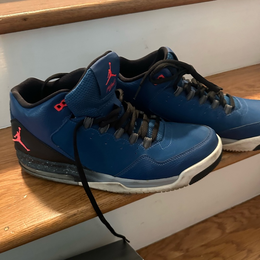 Jordan’s French Blue and Black Sneakers with Red Accents
